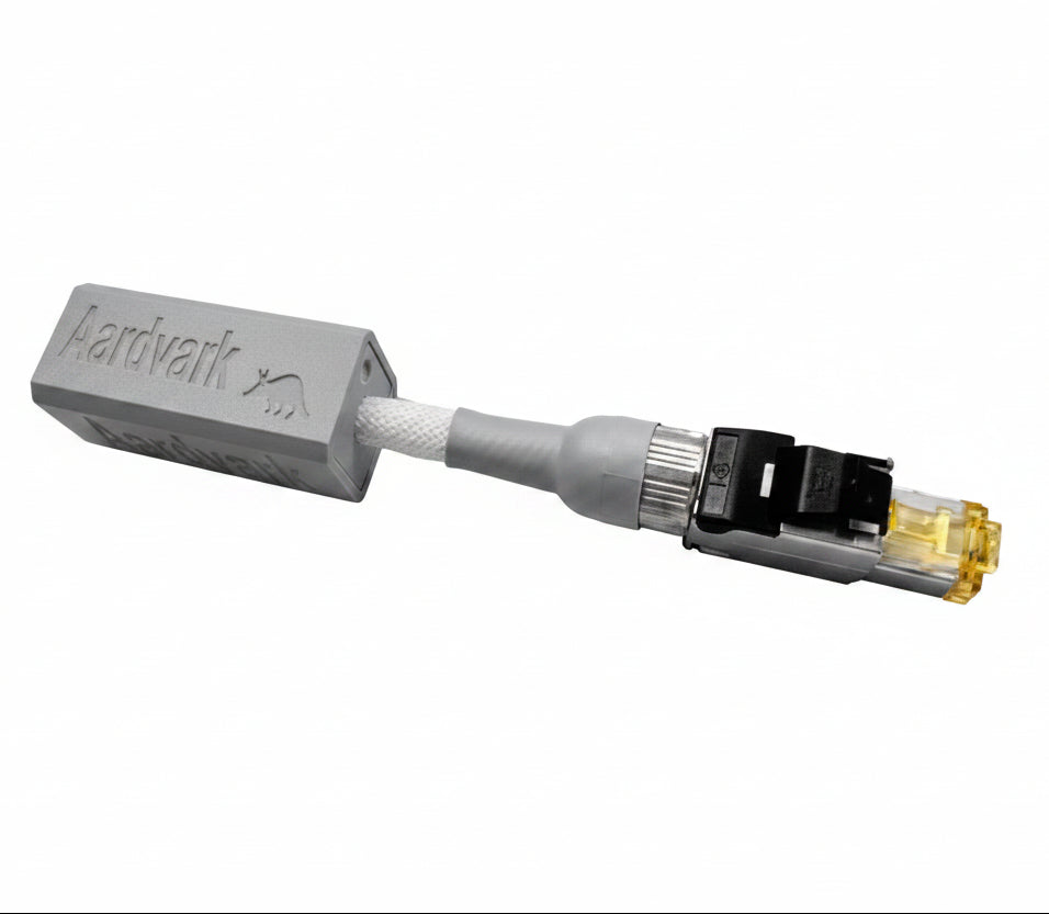 An Aardvark branded Ethernet noise isolation device with an RJ45 connector on one end and a transformer-coupled female jack on the other, placed on a white background.