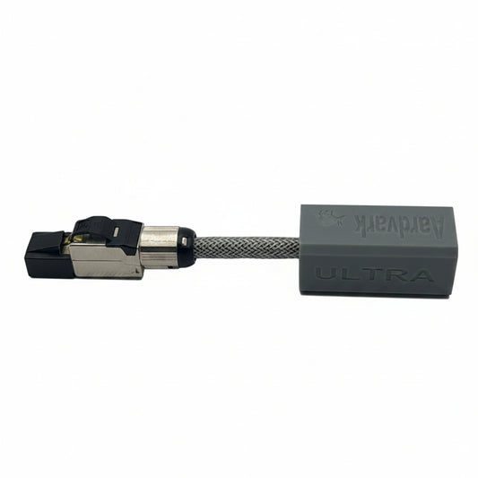 A gray and black Artvark ULTRA braided cable connector on a plain white background.